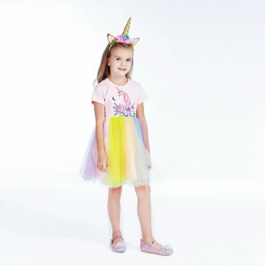Detail of unicorn princess dress featuring a rainbow tulle skirt and matching headband