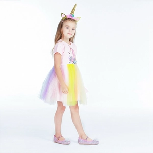 Detail of unicorn princess dress with colorful rainbow tulle skirt and floral pattern