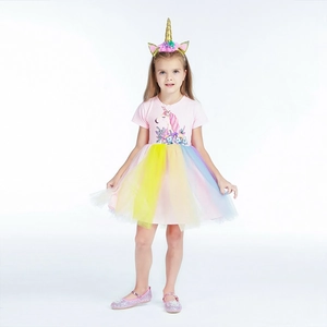 Close-up of unicorn print cotton top and colorful rainbow mesh tutu skirt set