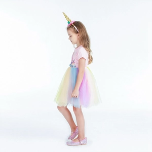 Detail of pink unicorn dress featuring a rainbow tulle tutu and golden horn headband