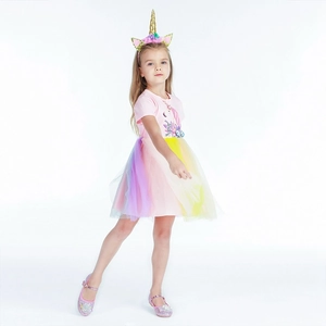 Detailed view of unicorn theme dress with rainbow mesh skirt and matching accessories
