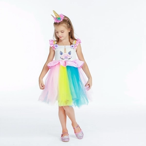 Close-up of girls unicorn princess dress with rainbow tulle skirt and floral headband