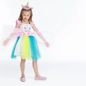 Close-up of girls unicorn princess dress with rainbow tulle and floral headband