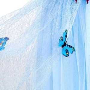 Detail of light blue mesh fabric with realistic 3D butterfly ornaments for princess dress