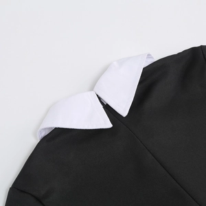 Detail of white Peter Pan collar on black Wednesday Addams dress with twill texture