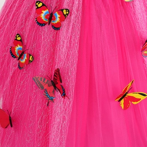 Close-up of pink tulle princess dress featuring colorful butterfly appliques and mesh texture