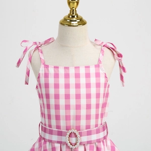Pink and white gingham girls dress with bow straps and pearl waist buckle on a mannequin