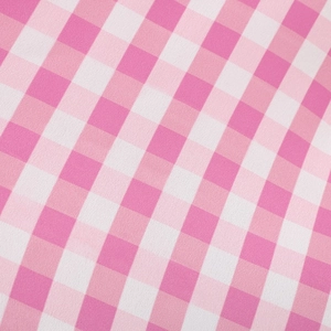 Close-up of pink and white gingham fabric texture for this girls' princess dress