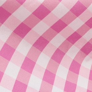 Close-up of pink and white gingham fabric texture for a girl's princess cosplay dress