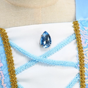 Detail of sequins, teardrop faux gem, and golden wave lace on Cinderella party dress
