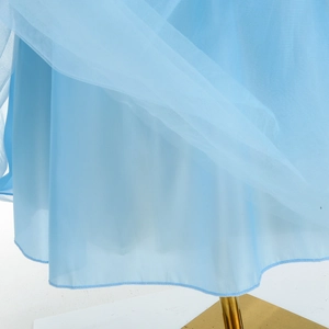 Detail of multi-layer blue mesh tulle and satin lining of girls Cinderella princess dress