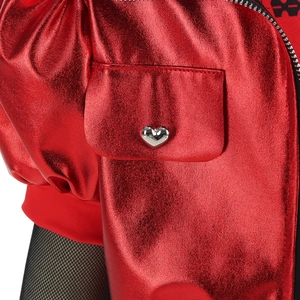 Macro detail of red metallic costume jacket featuring a silver heart button and textured fabric