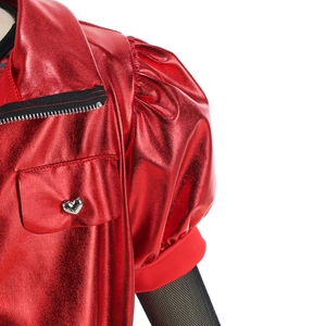 Detail of red metallic cosplay top with heart buckle and black mesh bubble sleeves