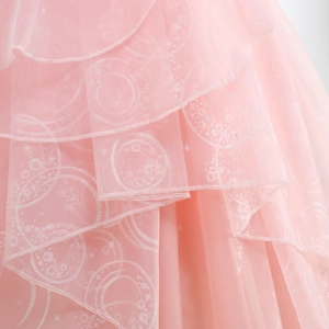 Detail of pink Glinda dress showing layered glitter tulle and sparkling silver patterns