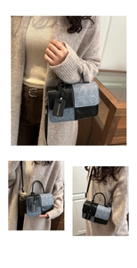 Detail of vintage contrast patchwork handbag showing leather texture and fashion charms