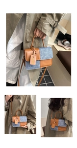Detail of vintage contrast handbag featuring brown faux leather and blue denim patchwork
