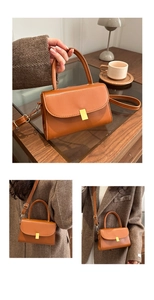 Detailed view of brown PU leather handbag with golden buckle on a wooden table setup