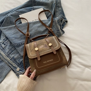 Vintage brown canvas backpack for women featuring cute cat design and leather details
