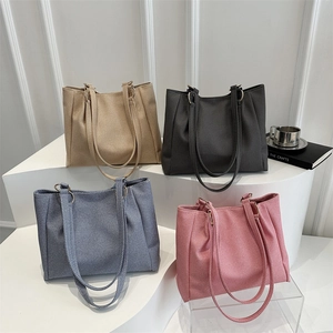 Minimalist large canvas tote bags in four colors arranged on geometric steps