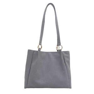 Minimalist grey-blue tote bag with golden metal buckles and long shoulder straps