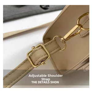 Detail view of the adjustable leather strap with premium gold metal buckle and spring hook