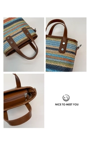 Detail view of colorful woven handbag with brown PU handles and interior zipper pocket