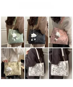 Multiple star-patterned tote bags in six colors with chain straps and plush charms