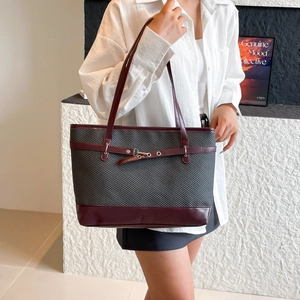 Minimalist deep grey and burgundy tote bag with leather straps for daily commute