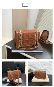 Detailed close-up of brown quilted faux leather bag with elegant gold chain strap