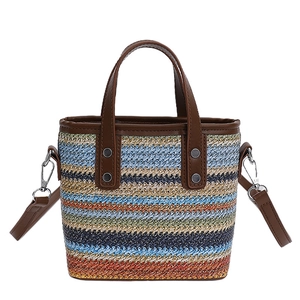 Colorful striped woven handbag with brown faux leather handles and detachable strap