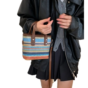 Rainbow woven tote bag with brown faux leather handles and detachable shoulder strap