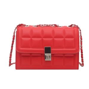 Classic red quilted crossbody bag with silver metal swivel lock and chain strap