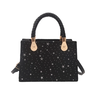 Chic black star pattern square handbag with braided handle and gold metal accents