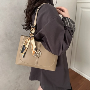 Minimalist khaki leather tote bag with silk scarf handle and metal M letter decoration