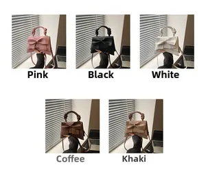 Detailweergave van handtassen met strik in vijf kleuren: roze, zwart, wit, koffie en kaki