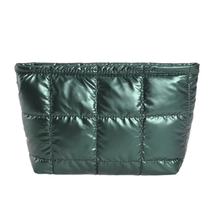 Glossy dark green quilted handbag with metallic finish and retro trapezoid design