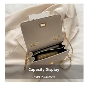 Interior view showing capacity of beige quilted shoulder bag for phone and wallet