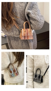 Close-up showing colorful woven textures and leather handles on mini crossbody straw bags