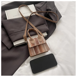 Mini woven crossbody bag featuring contrast wavy patterns and brown leather strap details