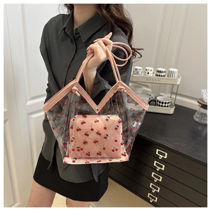 Detail of pink cherry print PVC tote bag set with inner pouch and metal buckle strap