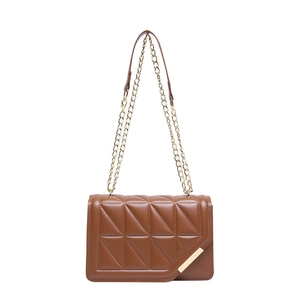 Brown quilted crossbody bag with gold chain strap and asymmetrical flap closure