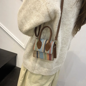Mini colorful striped woven crossbody bag with brown leather handles and a long strap