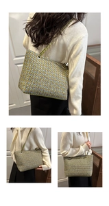 Close-up of multicolored tweed tote bag with metal chain strap and woven texture