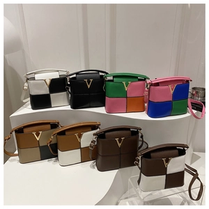 Detail of diverse color options for women's crossbody bags with metal V hardware
