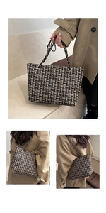Detail of multi-color woven tote bag featuring an elegant chain strap and large capacity