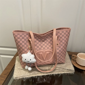 Pink PU tote bag with M-letter prints and cloud charm on a soft beige wool scarf