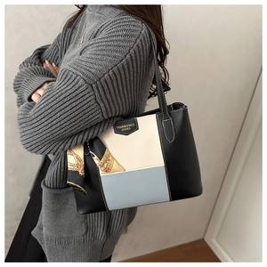 Three-color patchwork leather tote bag with decorative scarf and shoulder strap detail
