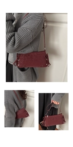Burgundy bow baguette bag with leopard pattern and silver rivet details