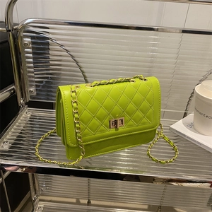 Chic lime green quilted leather crossbody bag with chain strap and gold hardware