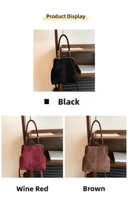 Three retro suede doctor bags in black wine red and brown on vintage wooden shelves